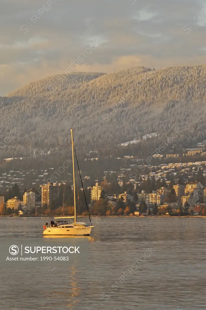 Sailboat in English Bay looking to West Vancouver and North Shore Mountains, Vancouver, British Columbia, Canada