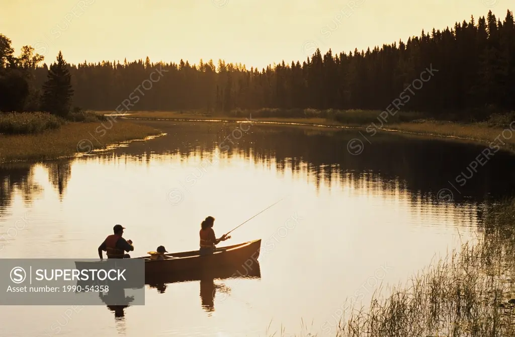 Family canoeing and fishing, Whiteshell River, Whiteshell Provincial Park, Manitoba, Canada