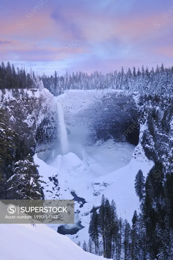 Helmcken Falls in winter with accumulated snow ice cone, Wells Gray Provincial Park, British Columbia, Canada