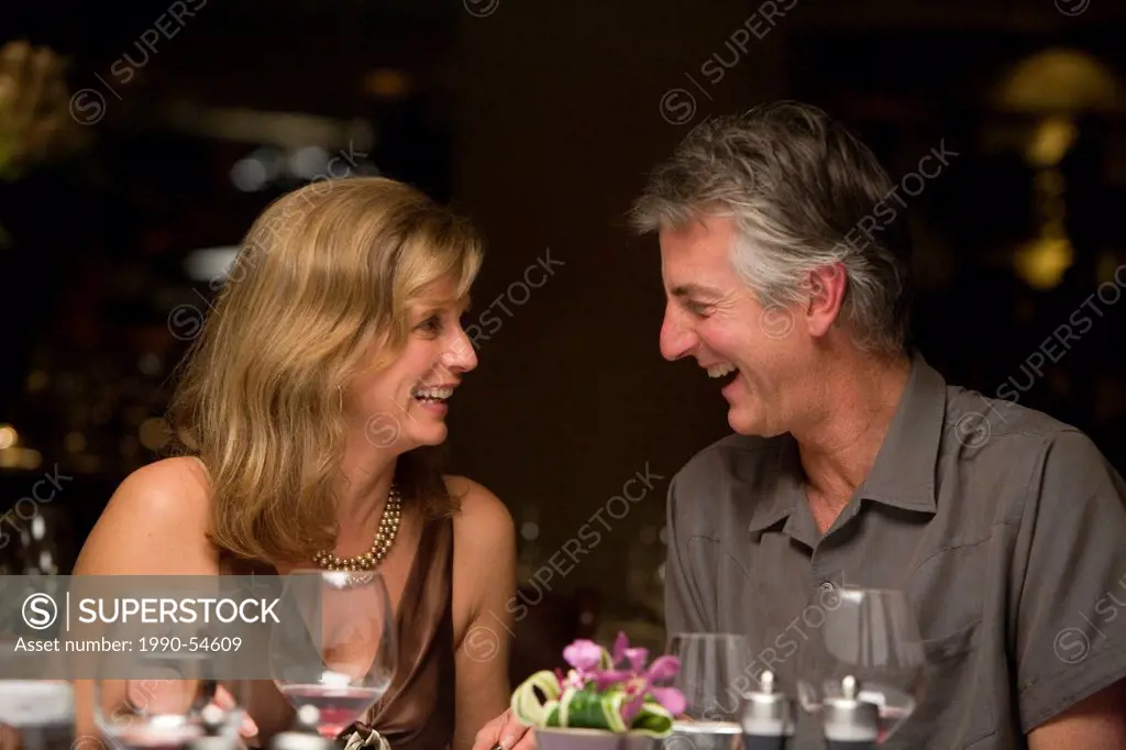 Middle_aged couple enjoying a fine dining experience, Whistler Village, British Columbia, Canada