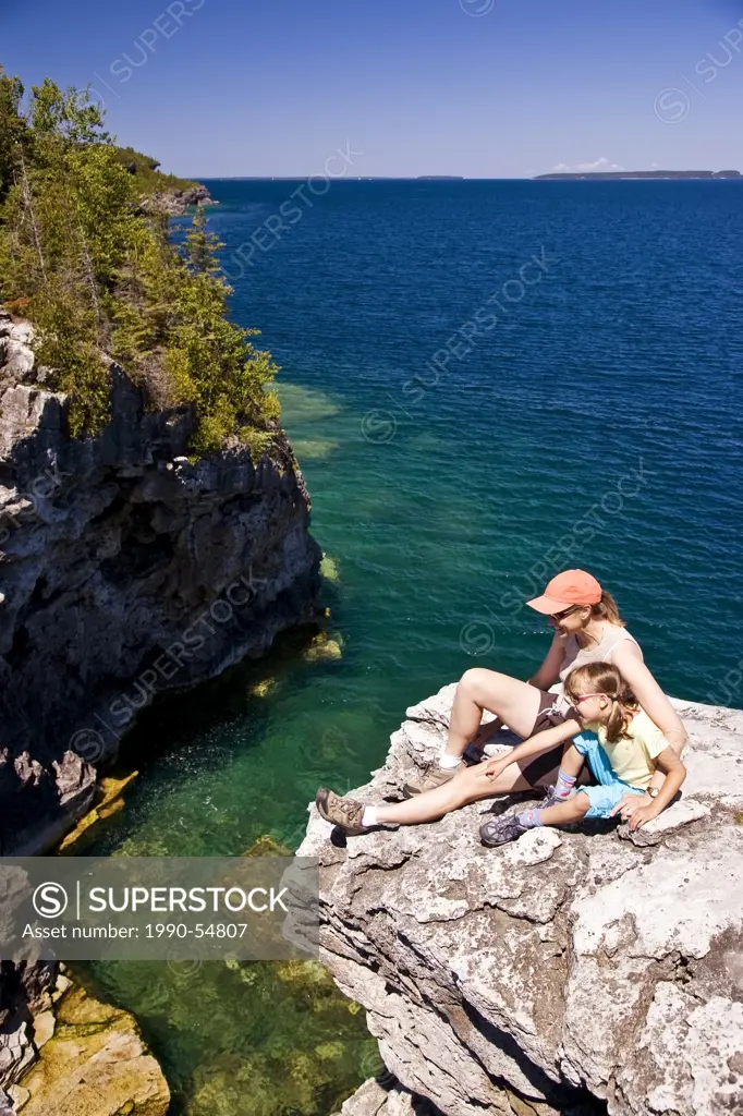 Young woman with daughter enjoy view at The Grotto along Bruce Trail, Bruce Penninsula National Park, near Tobermory, Ontario, Canada.