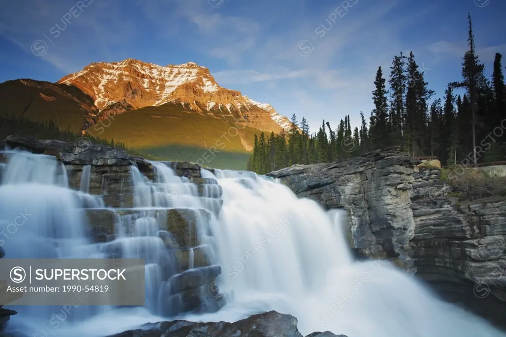 Athabasca Falls with Mount Kerkeslin in the background in early spring, Jasper National Park, Alberta, Canada