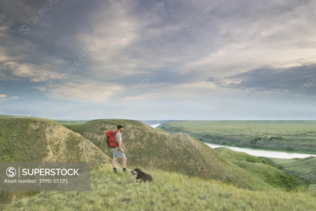 Hiker and dog, The Big Bend, South Saskatchewan River, Saskatchewan, Canada