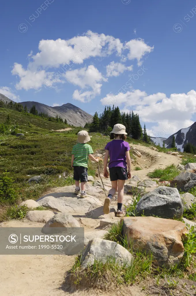 Brother and sister on a family hike, Edith Cavell Meadows, Jasper National Park, Alberta, Canada