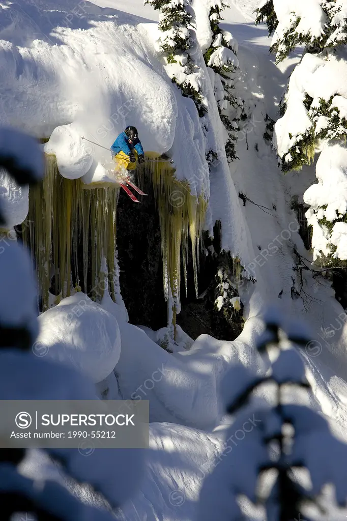 Whistler Backcountry, skier jumping off ice falls