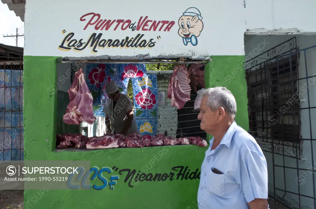 Street scene with meat vendor, Holguin, Cuba