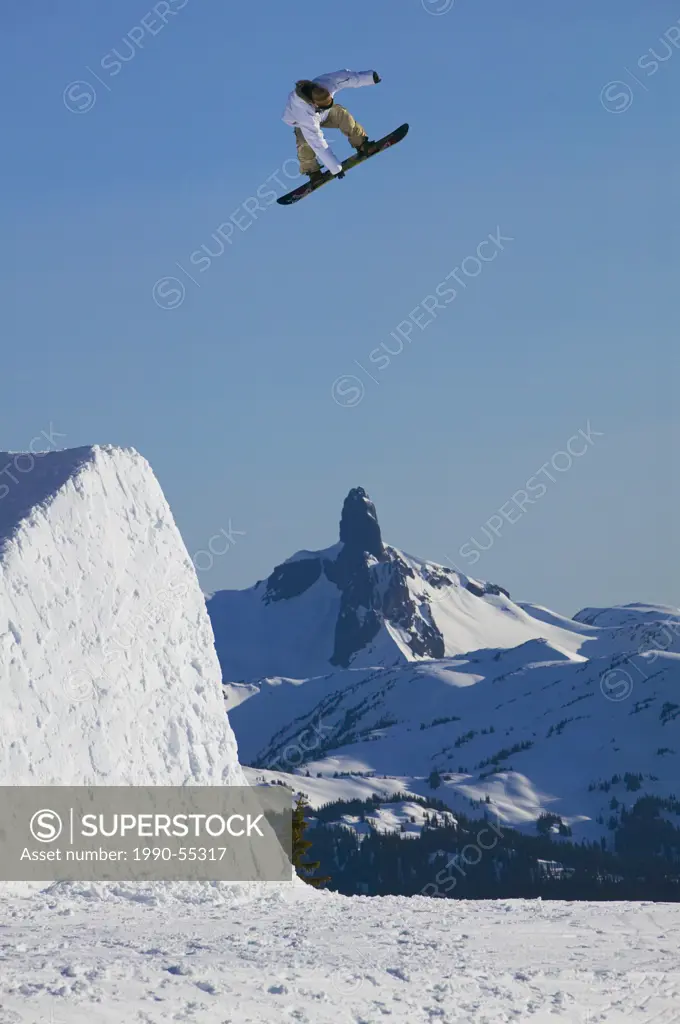 Arial competetion on whistler mountain with black tusk and the tantalus range in the background, british columbia, Canada.