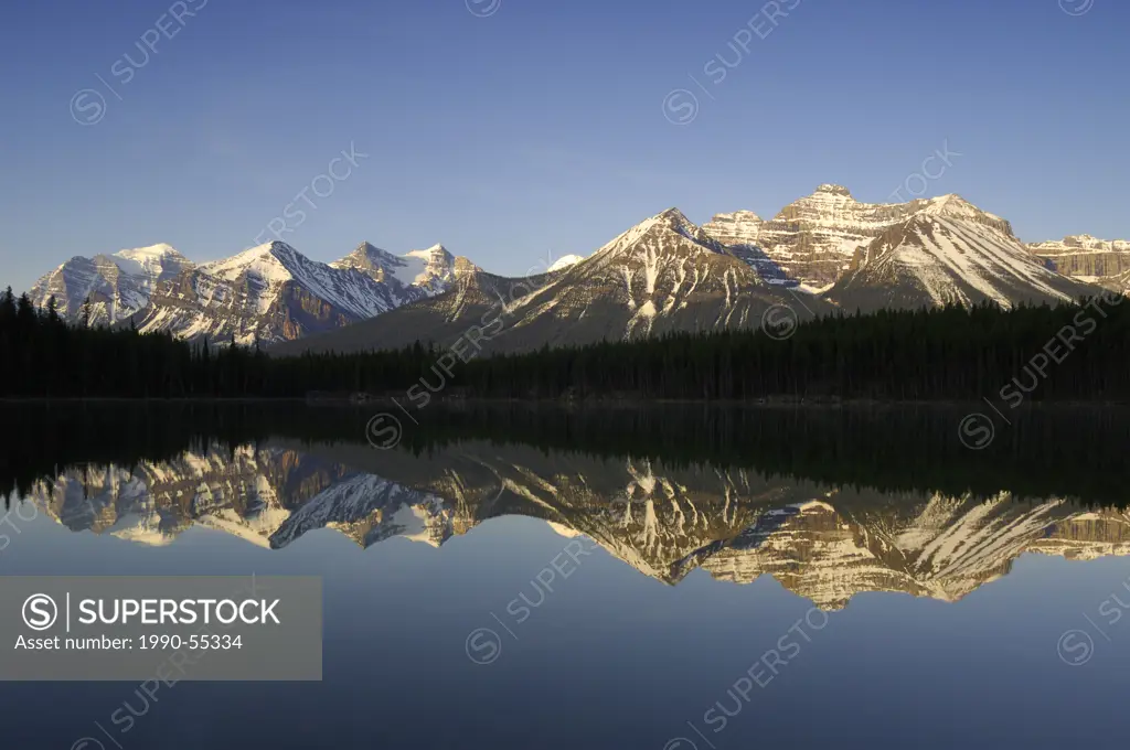 Sunrise on the Bow Range and Herbert Lake along the Icefields Parkway, Banff National Park, Alberta, Canada.