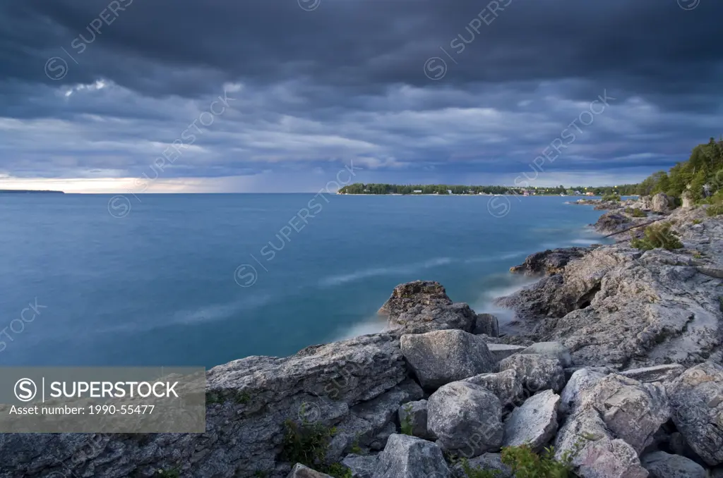 Dramatic skies over Lake Huron at the northern tip of the Bruce Peninsula, Fathom Five National Marine Park, Ontario, Canada.