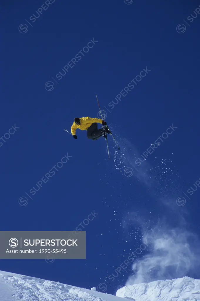 A skier catching air off a jump at Sunshine Village, Banff National Park, Alberta, Canada