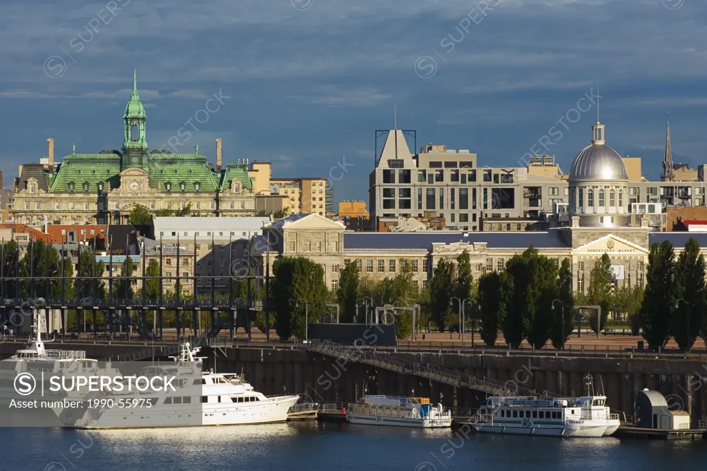 View across St. Lawrence to Old Montreal, city hall in background, Montreal, Quebec, Canada.