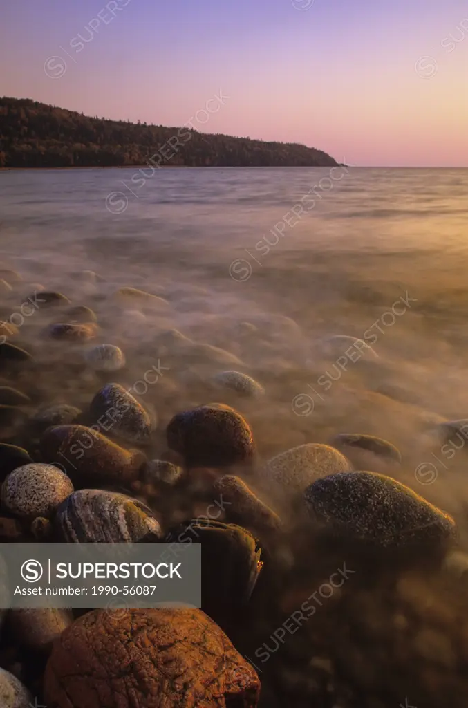 The rocky shoreline of Lake Superior at sunset, Gargantua Harbour, Lake Superior Provincial Park, Ontario, Canada.