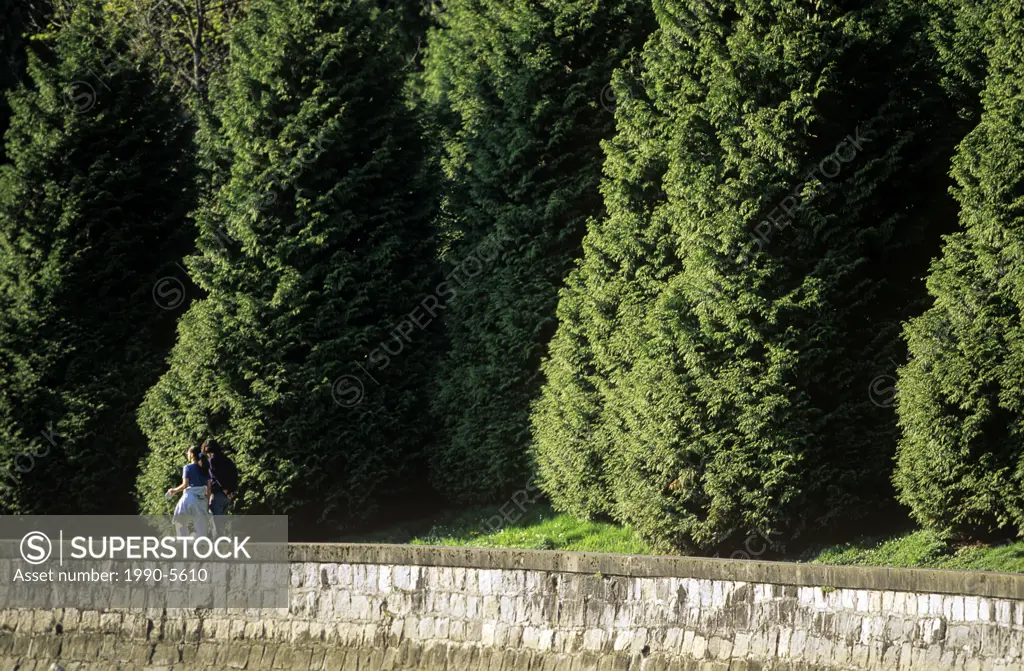 Couple walking along seawall at Stanley Park, Vancouver, British Columbia, Canada