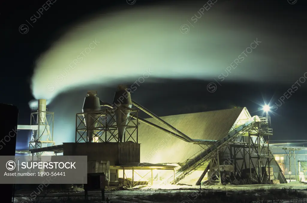 Panelboard plant at night, Smithers, British Columbia, Canada.