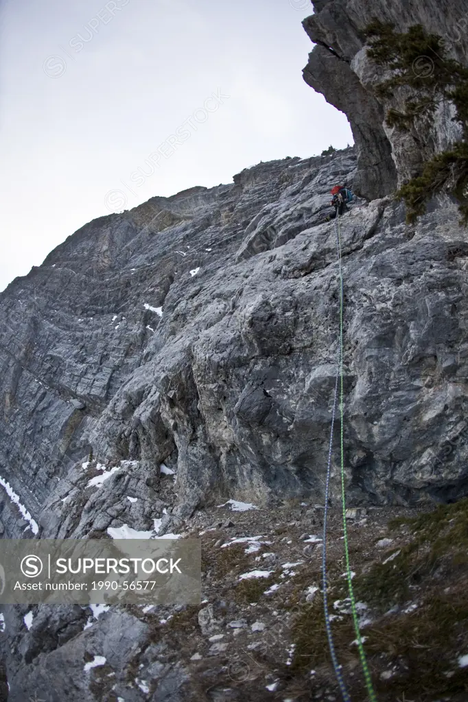 A man alpine climbing _ Coire Dubh Integrale 5.7, WI3, Canmore, Alberta, Canada
