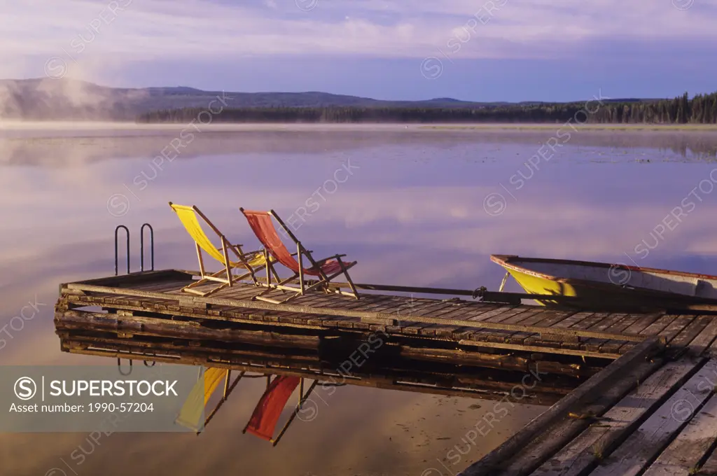Dock and chairs on spout Lake in front of Ten_ee_ah Lodge in the Cariboo region of British Columbia, Canada.
