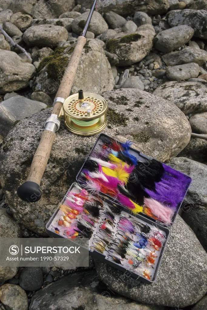 Speyrod and flybox on rocks beside river, Bulkley river, British Columbia, Canada.