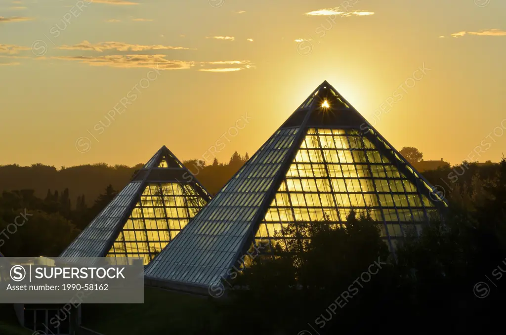 Sunrise behind pyramid of Muttart Conservatory, Botanical Garden, Edmonton, Alberta, Canada