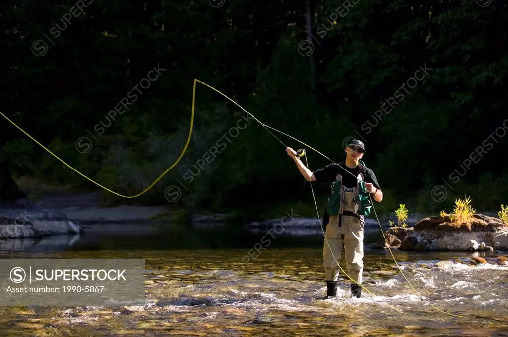 Flyfisher on the Cowichan River near Skutz Falls, Cowichan Valley, Vancouver Island, British Columbia, Canada