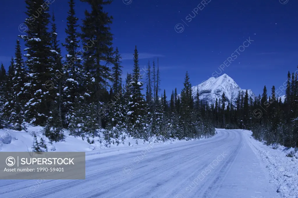 Mount Shark Road on a clear night with a view of Mount Shark. Kananaskis Country, Alberta, Canada