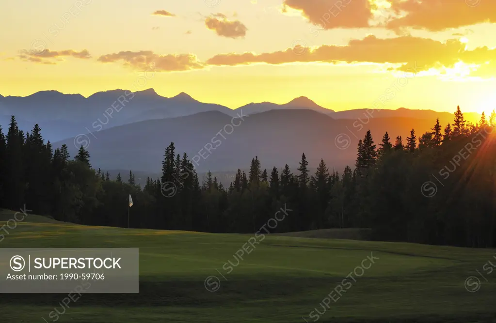 A colored image of a golf green at sunset with no people in the town of Hinton Alberta in the foothills Rocky Mountains of Alberta Canada
