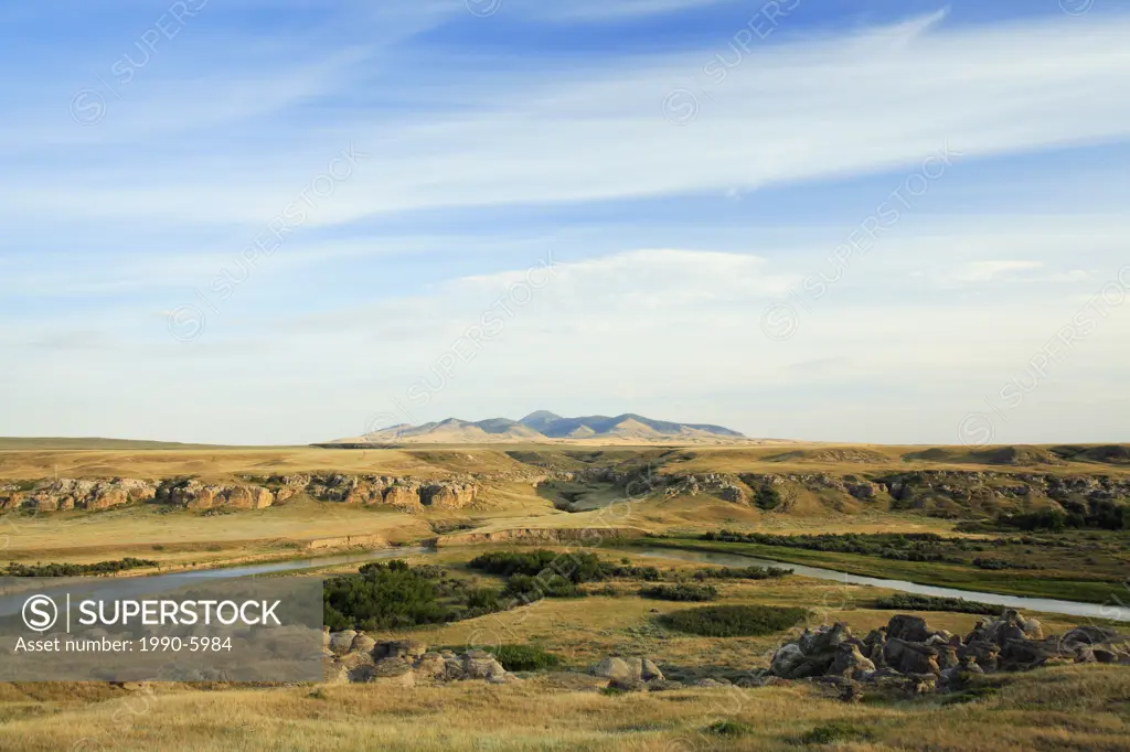 Looking over the Milk River Valley and Alberta badlands towards the Sweetgrass Hills in Montana  Writing-on-Stone Provincial Park, Alberta, Canada