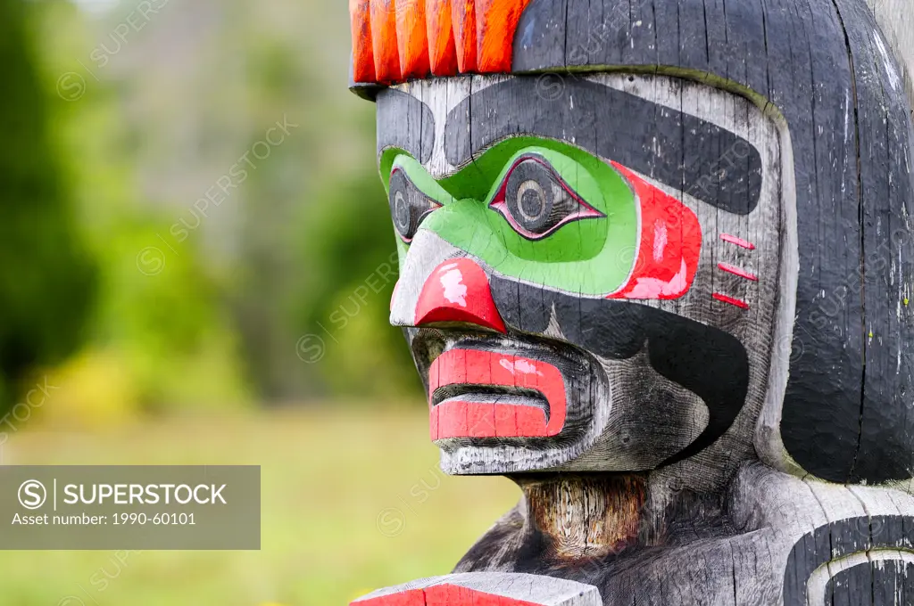 Memorial totem poles at the Namgis Burial Grounds, Alert Bay, Cormorant Island, near Vancouver Island in British Columbia.