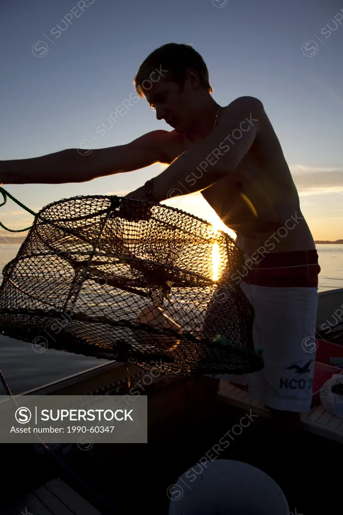 Youth Setting Prawn Traps, Fishing, Boating, Calm, Summer, Sunset, Savary Island, Strait of Georgia, Sunshine Coast, B.C., Canada