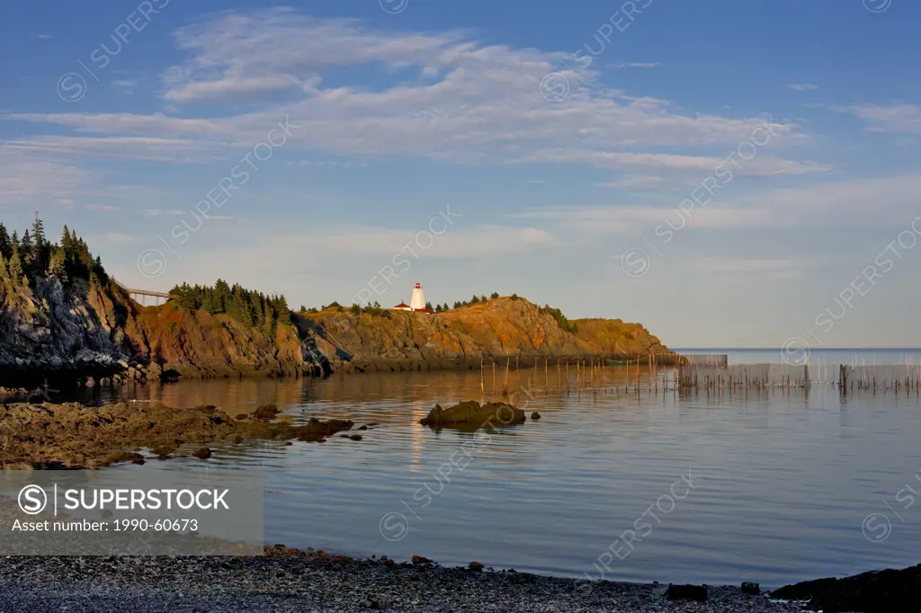 Weir net in front of Swallowtail Lighthouse, Grand Manan Island, Bay of Fundy, New Brunswick, Canada