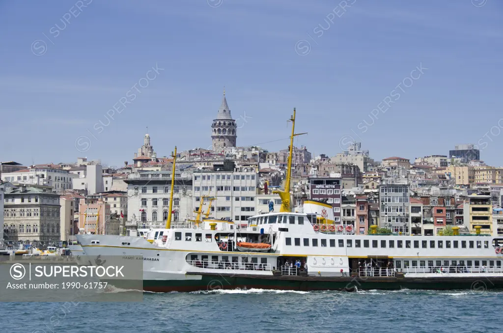 Ferries on the Golden Horn with Beyoglu district and Galata Tower beyond, Istanbul, Turkey