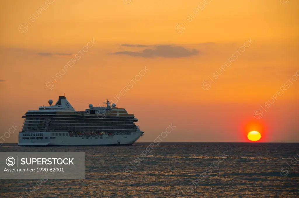 Cruise ship leaving Kusadasi, a resort town on Turkey´s Aegean coast in Aydin Province at sunset