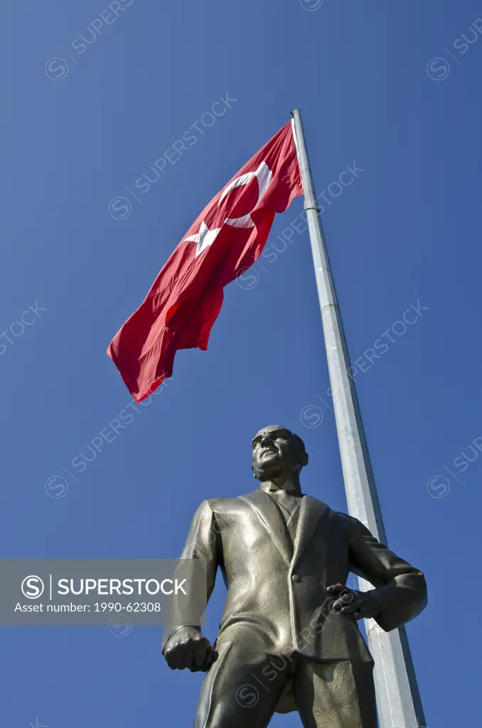 Turkish flag and Memorial statue of Mustafa Kemal Atatürk, first President of Turkey, Istanbul, Turkey