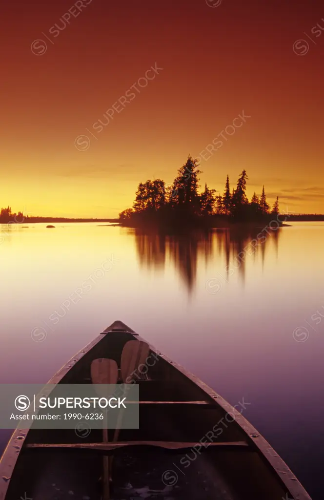 Canoe along lake, Otter Falls, Whiteshell Provincial Park, Manitoba, Canada