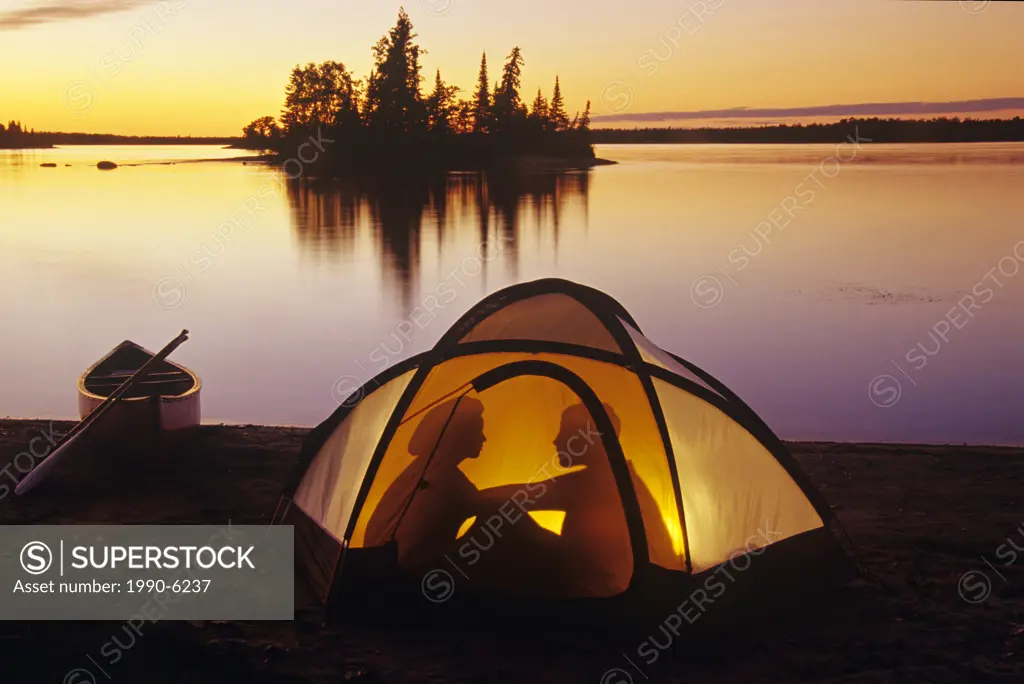 Couple camping at Otter Falls, Whiteshell Provincial Park, Manitoba, Canada