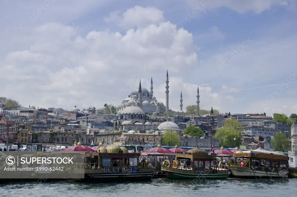 Floating restaurants and the Rüstem Pasha Mosque, located in the Eminönü district of Istanbul, Turkey.