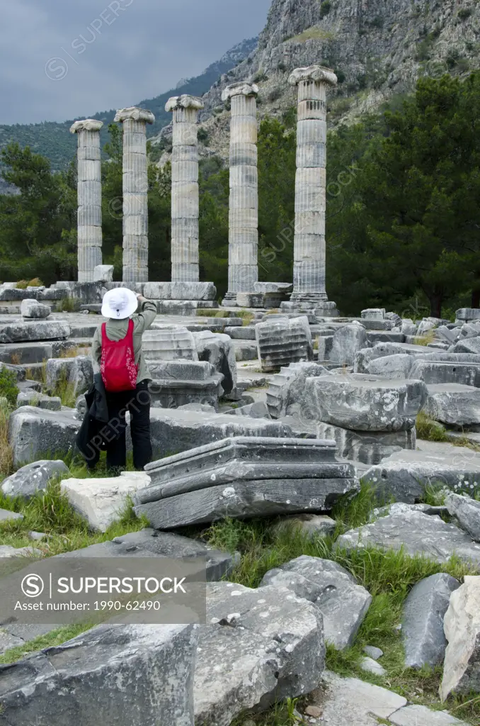 Visitors at Priene, ruins of an ancient Greek city of Ionia at the base of an escarpment of Mycale, 25 kilometres 16mi from ancient Miletus, Turkey