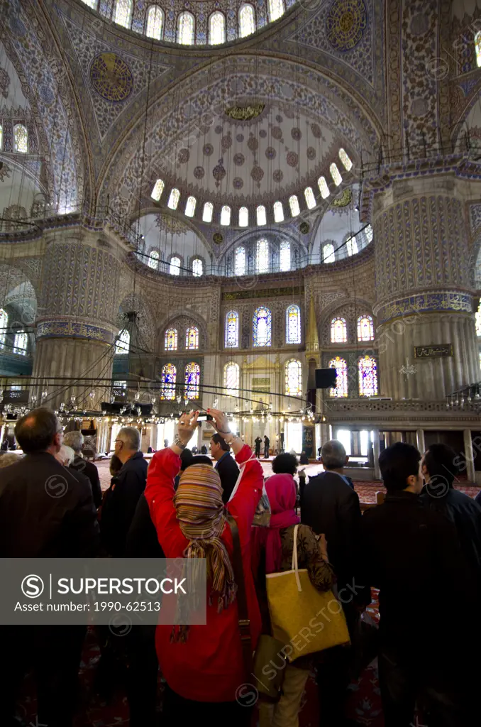 Tourists in the main Dome, Sultan Ahmed Mosque Blue Mosque, Istanbul, Turkey