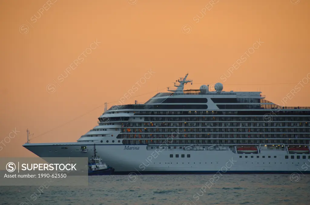 Cruise ship leaving Kusadasi, a resort town on Turkey´s Aegean coast in Aydin Province at sunset
