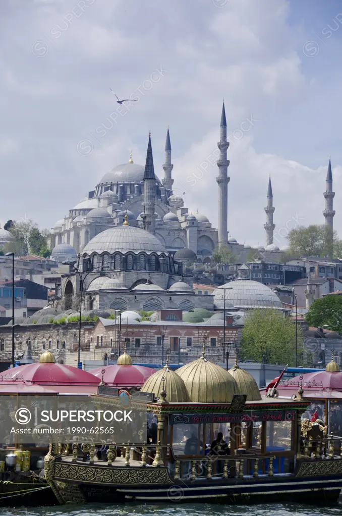 Floating restaurants and the Rüstem Pasha Mosque, located in the Eminönü district of Istanbul, Turkey.
