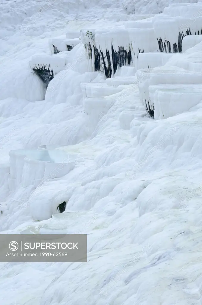 Pamukkale hot springs and travertines, terraces of carbonate minerals left by the flowing water in Denizli Province in southwestern Turkey
