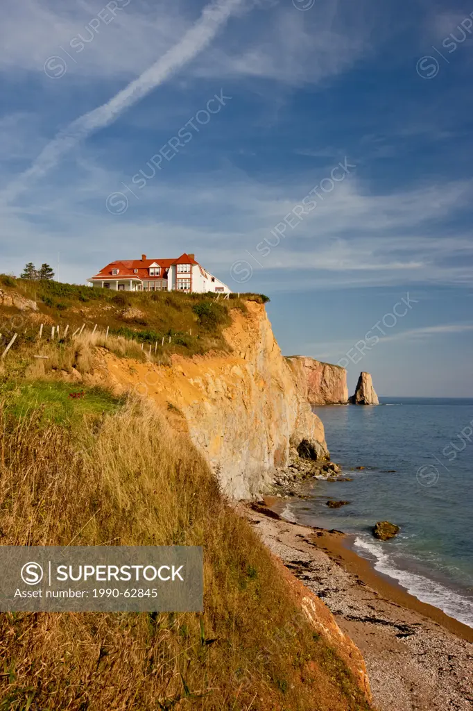 House on cliff, and Perce Rock, Perce, Quebec, Canada