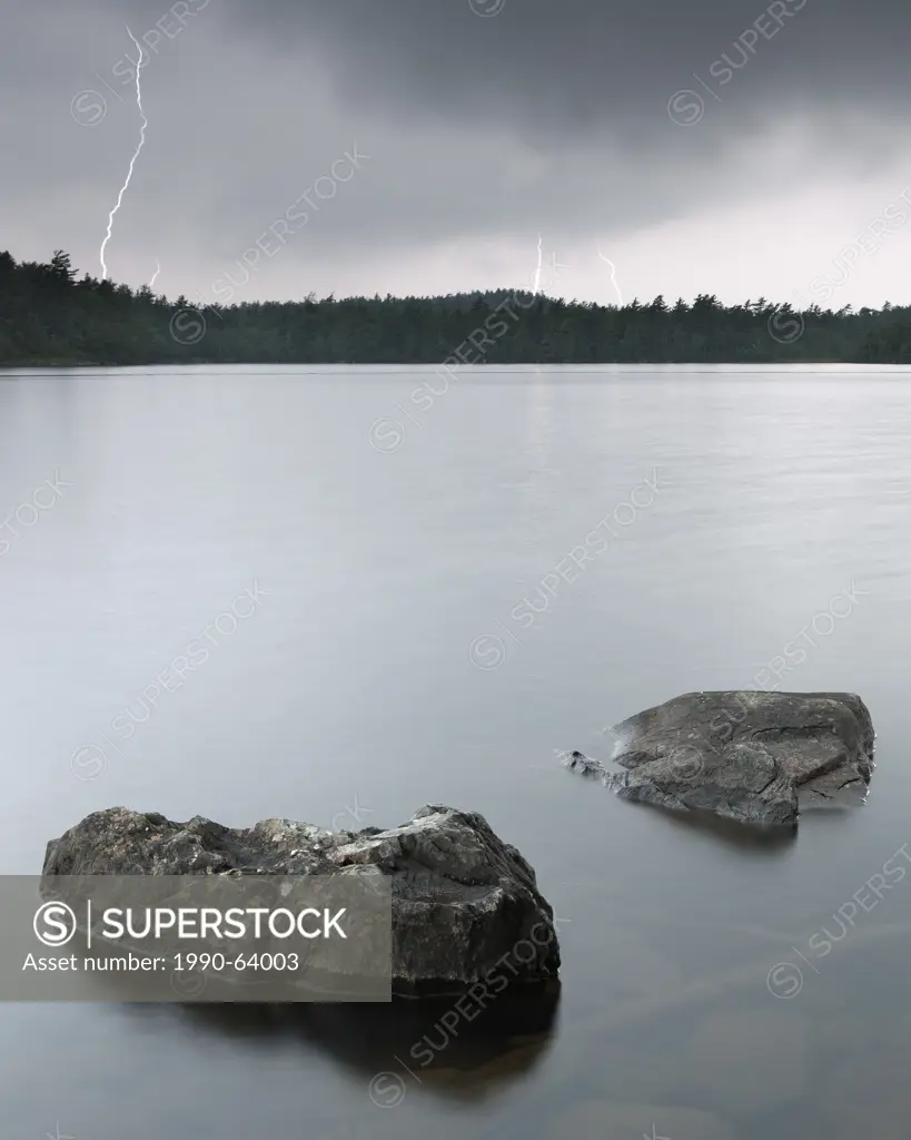 Multi_bolt cloud to ground lightning strike at Powder Mill Lake, Waverely, Nova Scotia outside Halifax.