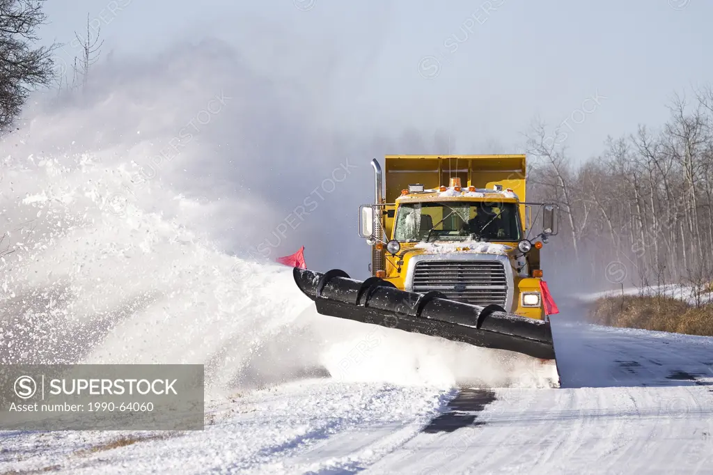 Snow plow, plowing snow from road, Elk Island National Park, Alberta, Canada