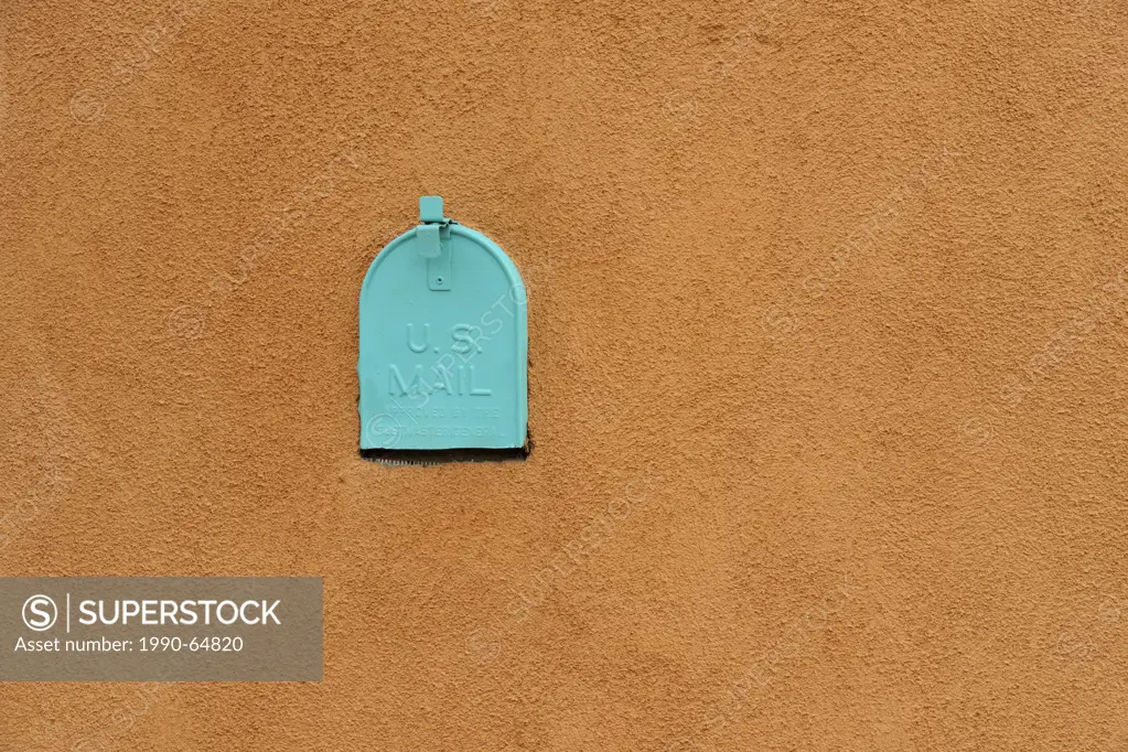 Adobe wall details, with painted mail box in residential Santa Fe, Santa Fe, New Mexico, USA