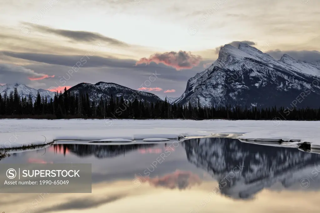 Mount Rundle reflected in the Vermilion Lakes at dawn