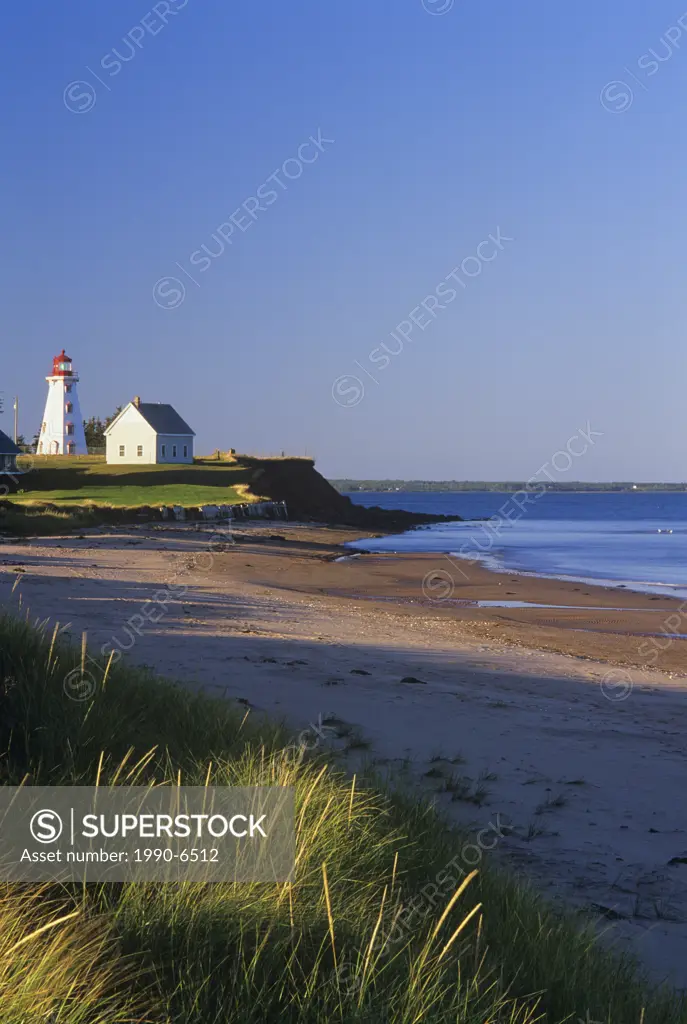 Lighthouse at low tide in Panmure Island Provincial Park, Prince Edward Island, Canada