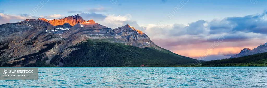 Early morning light on Mount Jimmy Simpson from the shores of Bow Lake, Icefields Parkway, Banff National Park, Alberta, Canada
