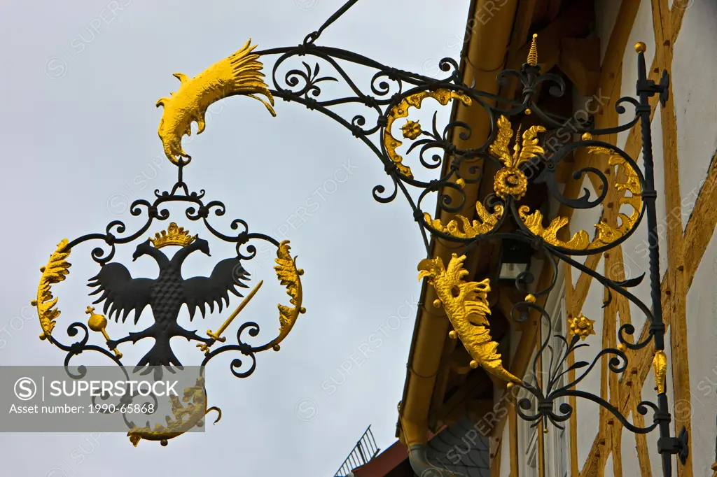 Intricate wrought iron bracket on the side of a building in Hessenpark Open Air Museum, Neu_Anspach, Hessen, Germany, Europe.