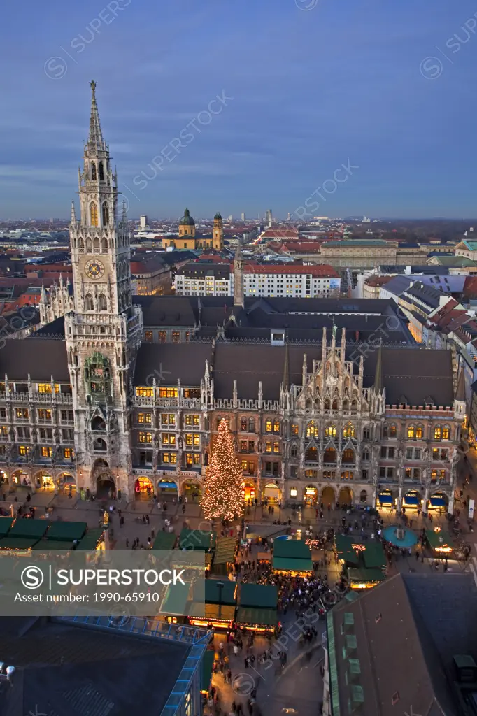 Aerial view of the Christkindlmarkt Christmas Markets in the Marienplatz outside the Neues Rathaus New City Hall at dusk in the City of München Munich...