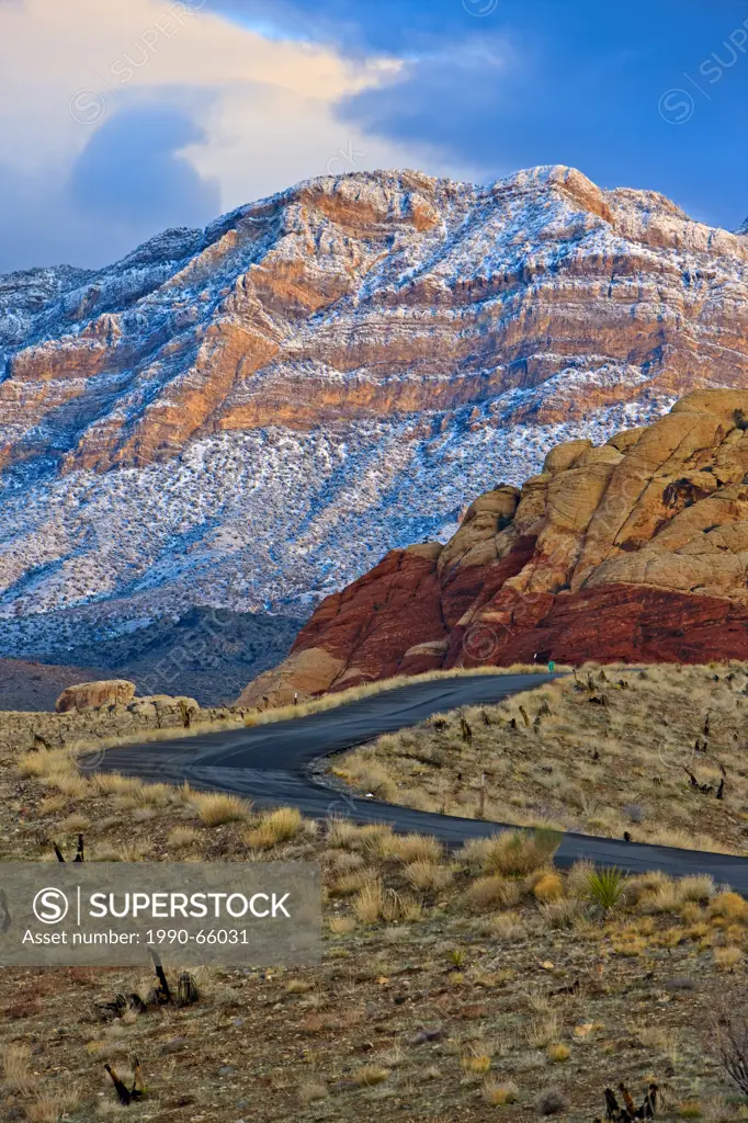 Spring Mountains, Red Rock Canyon National Conservation Area, Park road of Red Rock Canyon National Conservation Area and snow coverred Spring Mountai...